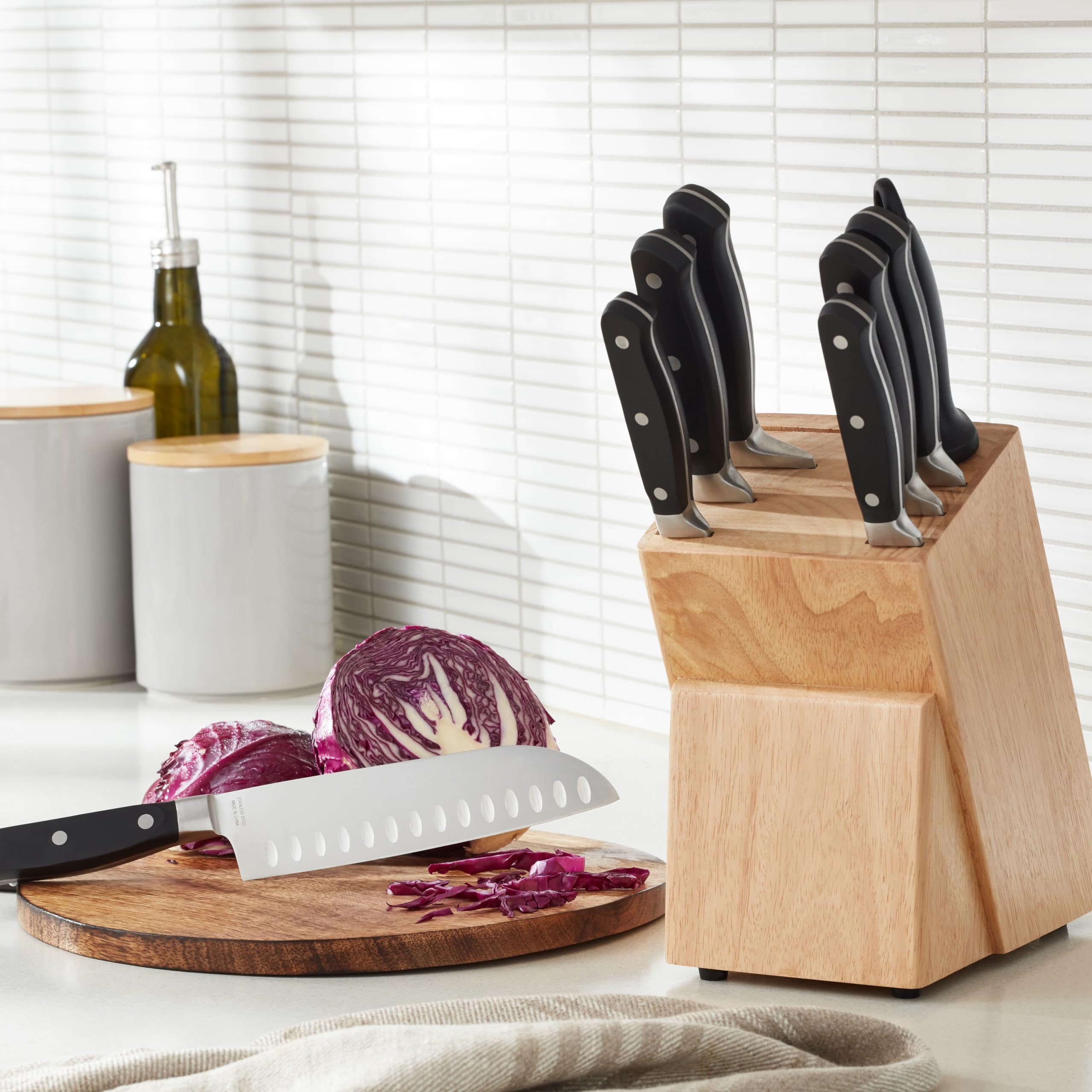 Amazon Basics Set coltelli 9 pezzi con ceppo nero